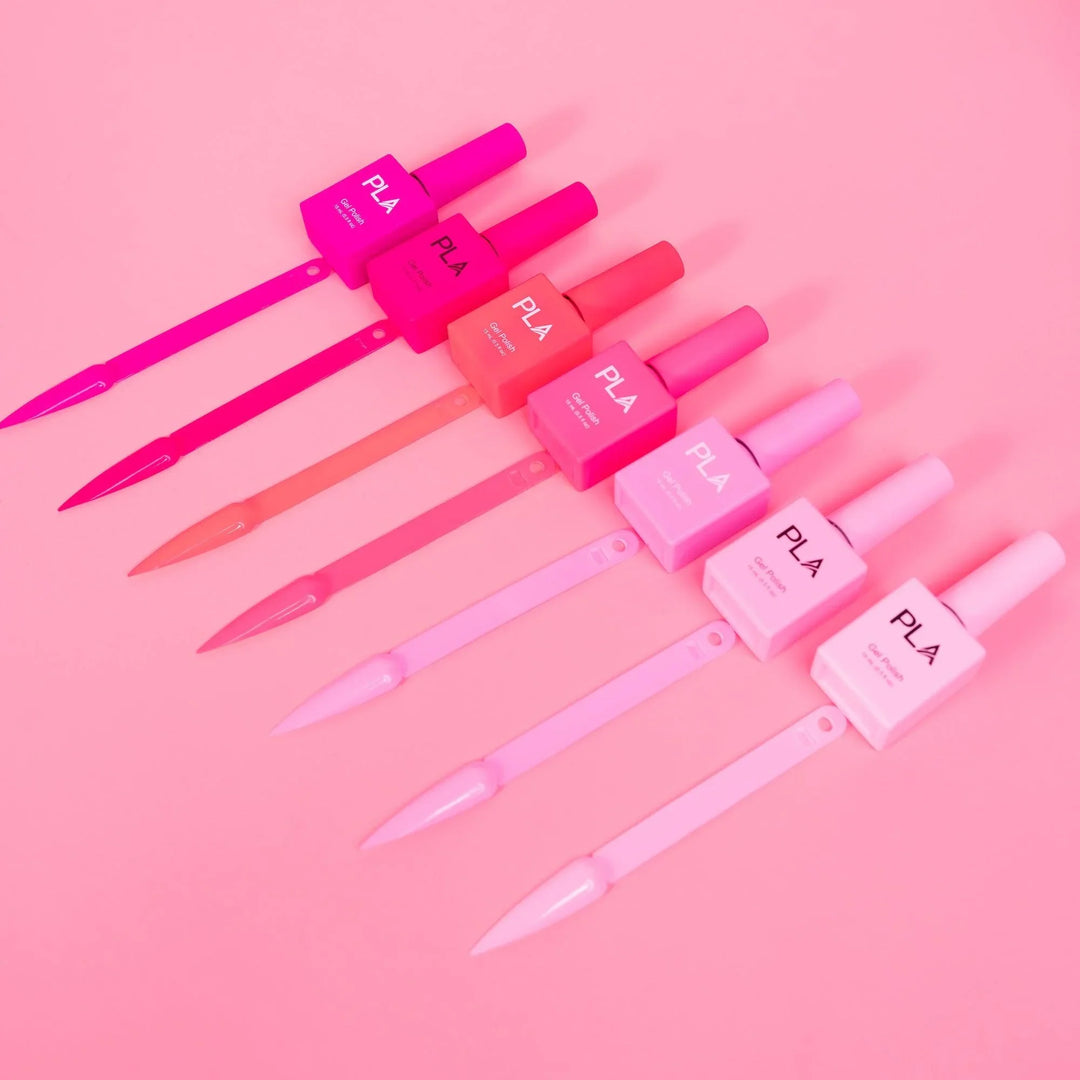 Mini nail polish sets from Paris Lash Academy — Pinks (gel polishes, laying down out of box with color swatch)
