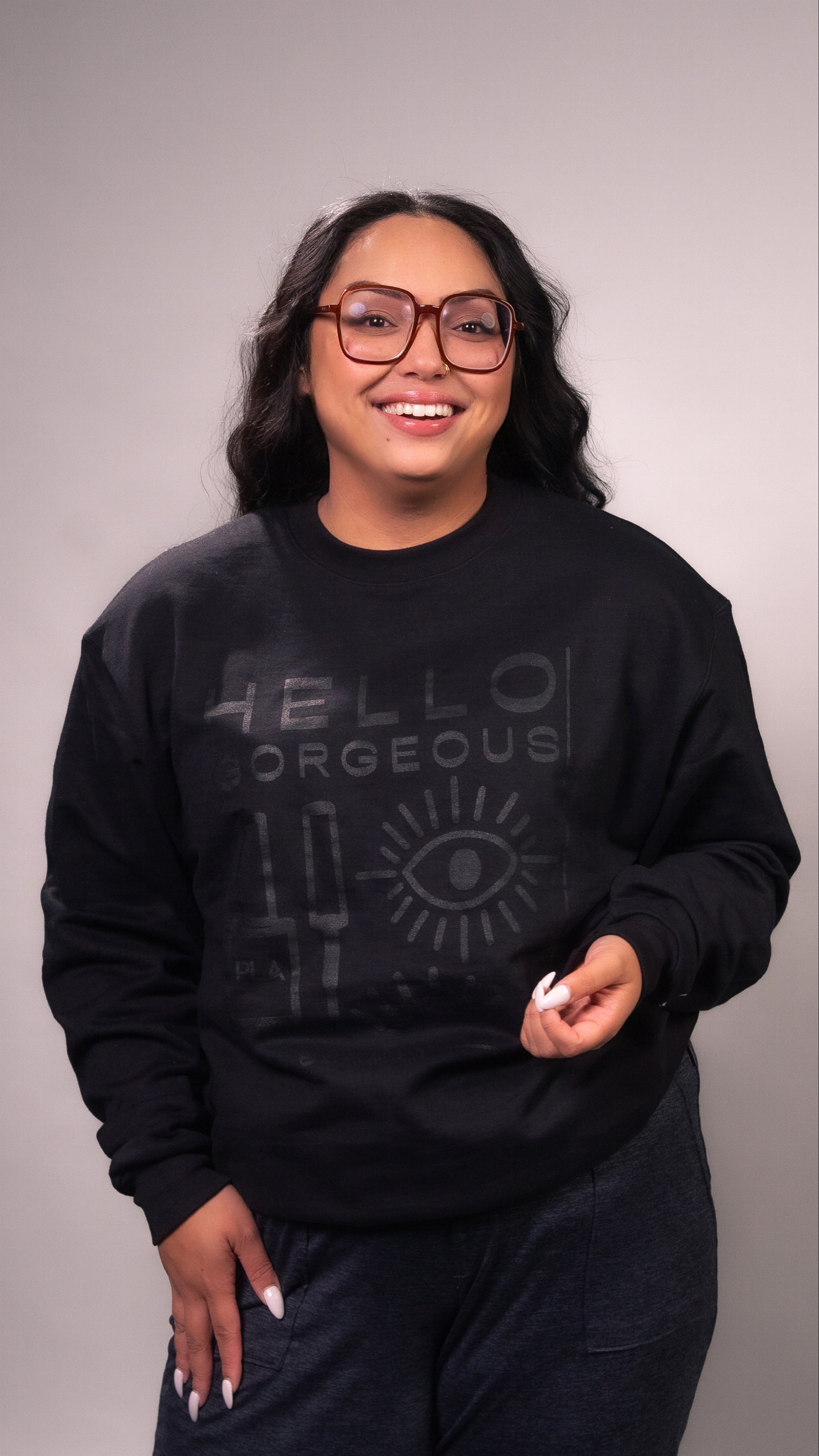 PLA Lash Sweatshirt, Black on Black Crewneck (front view of the crewneck, hello gorgeous with eyelashes and PLA nail polish bottle design)