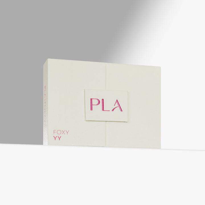 A cream-colored rectangular product box with a small front label reading &