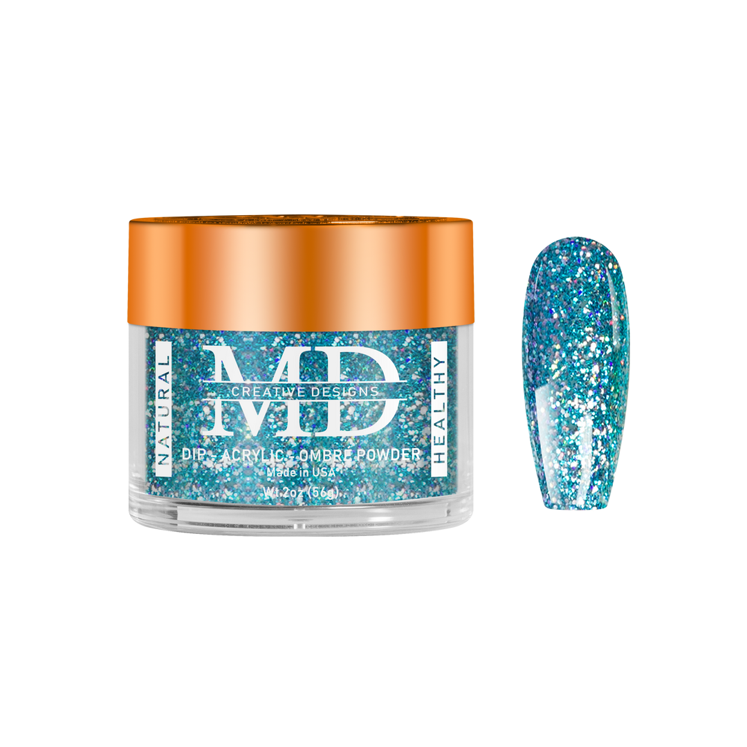 Jar of blue glittery powder with a nail tip swatch on a white background
