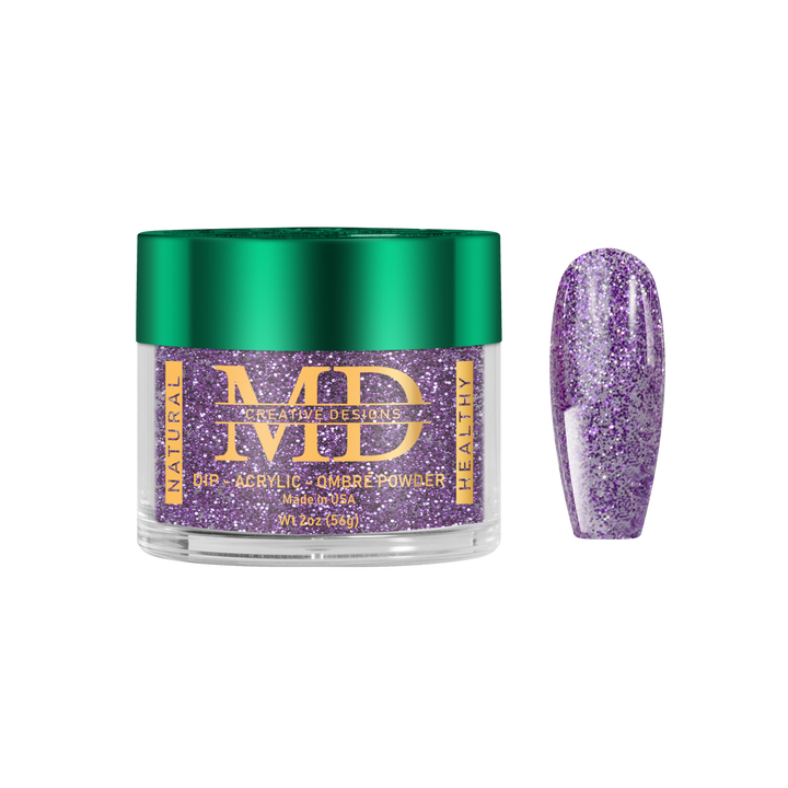 Jar of purple glittery powder with a green lid on a white background