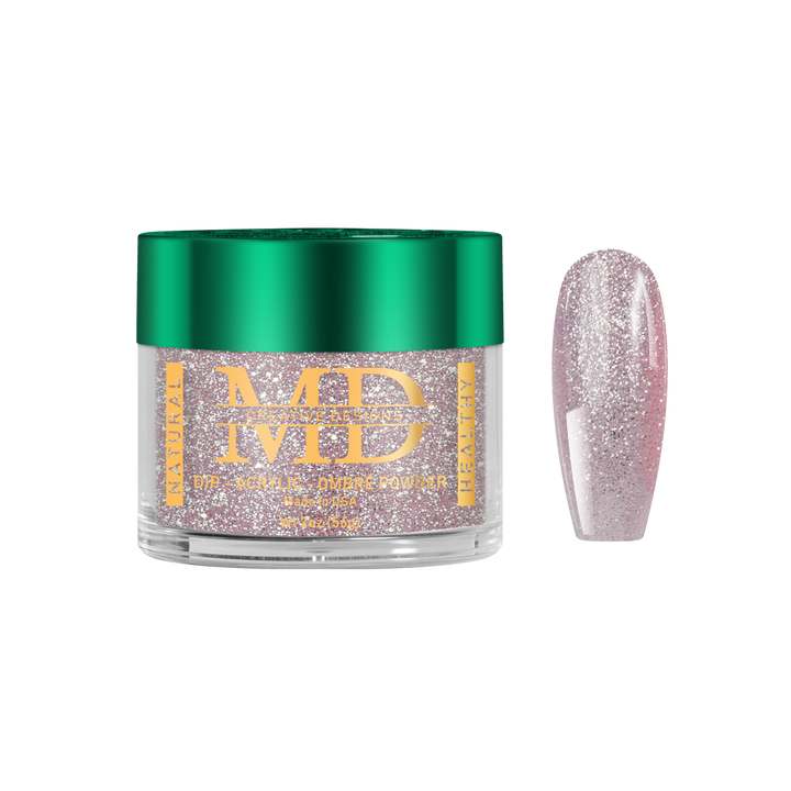 Jar of glittery nail powder with a pink glittery nail tip next to it on a white background