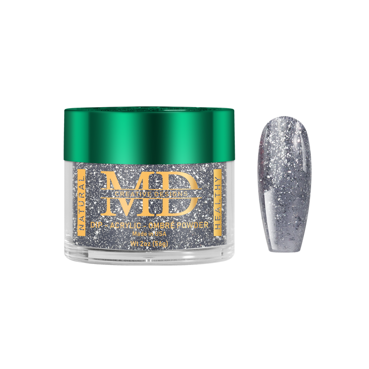 Jar of MD acrylic powder with a silver glittery nail tip on a white background