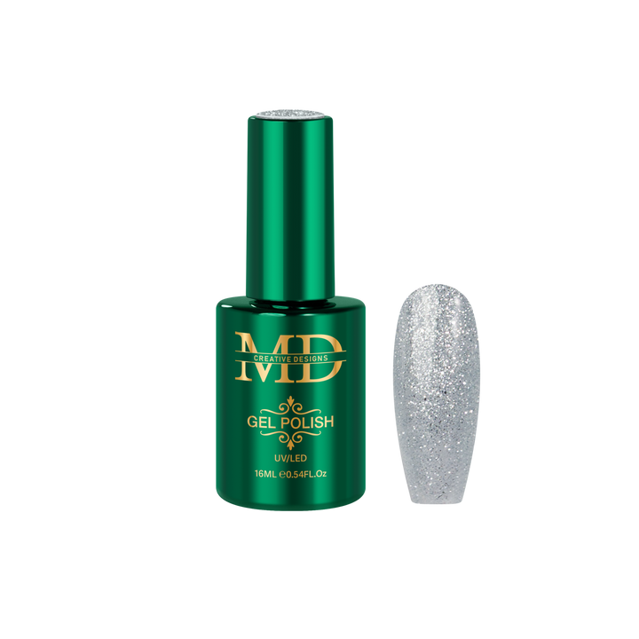 Green gel polish bottle with a glittery silver nail tip next to it on a white background