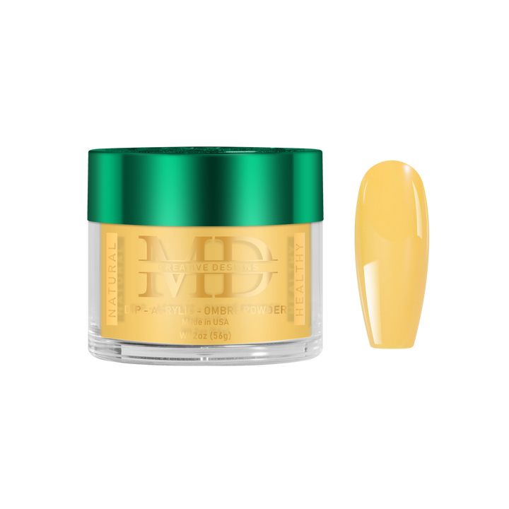 Gold-colored powder in a jar with a green lid, next to a yellow nail color swatch on a white background.