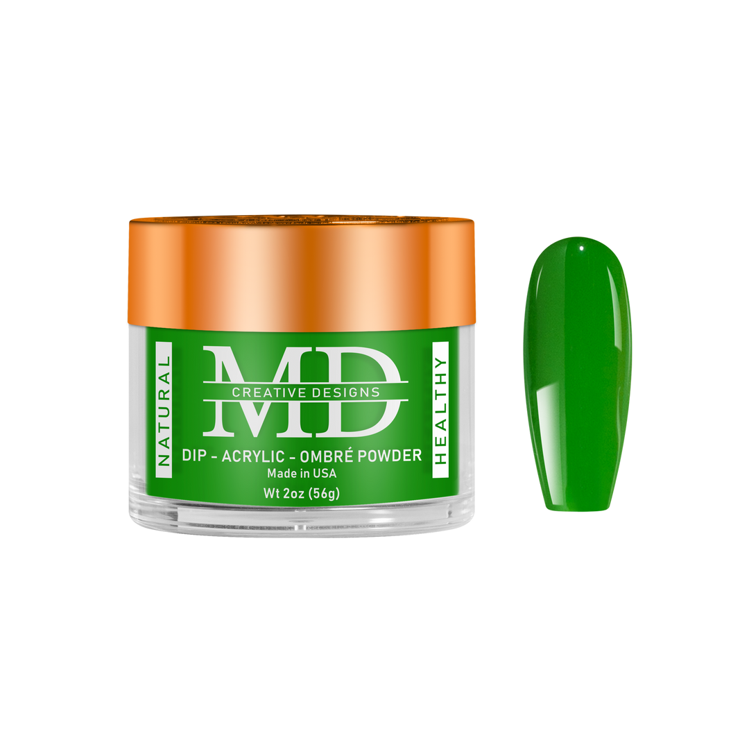 Green nail powder in a clear container with an orange lid on a white background