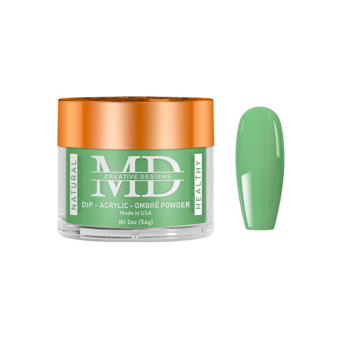 Green nail powder with orange lid on a white background