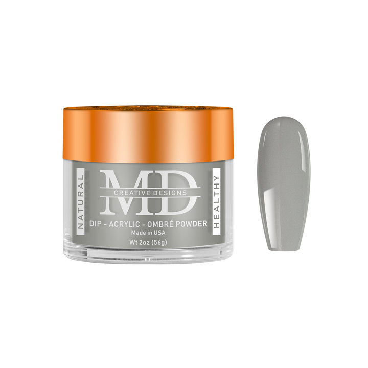 Jar of MD Dip Acrylic Ombré powder with a gray nail swatch on a white background