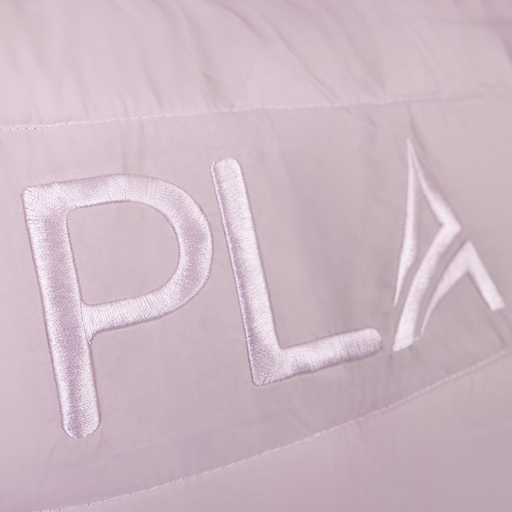 Close-up of a light pink tote bag with 'PLA' embroidered in light pink.
