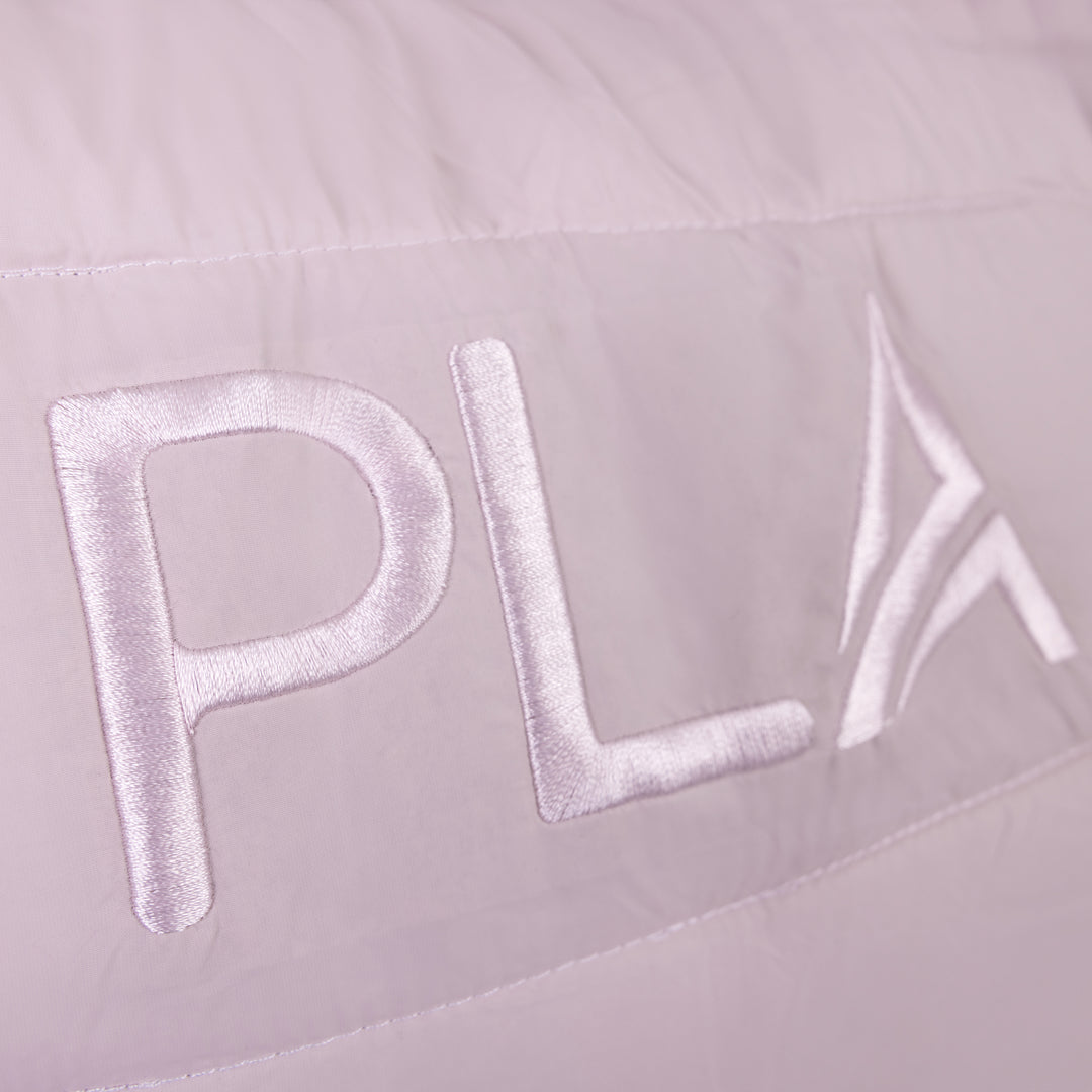 Close-up of a light pink tote bag with &