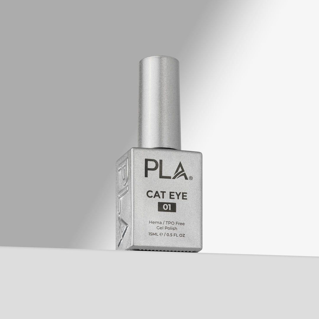 A bottle of PLA Cat Eye 01 gel nail polish with a silver cap and a square silver bottle, standing on a light gray surface against a gray background.
