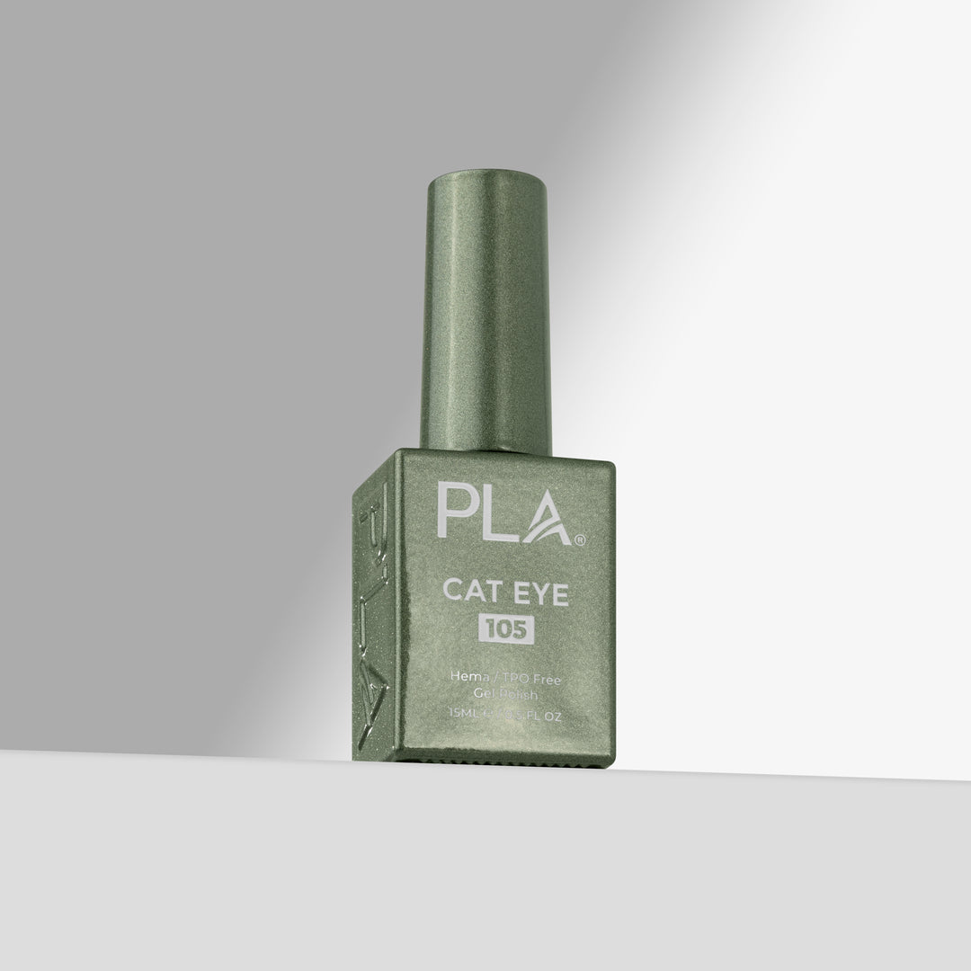 A bottle of PLA Cat Eye 105 nail polish in a sage green shade, standing upright on a light gray surface against a gray background 