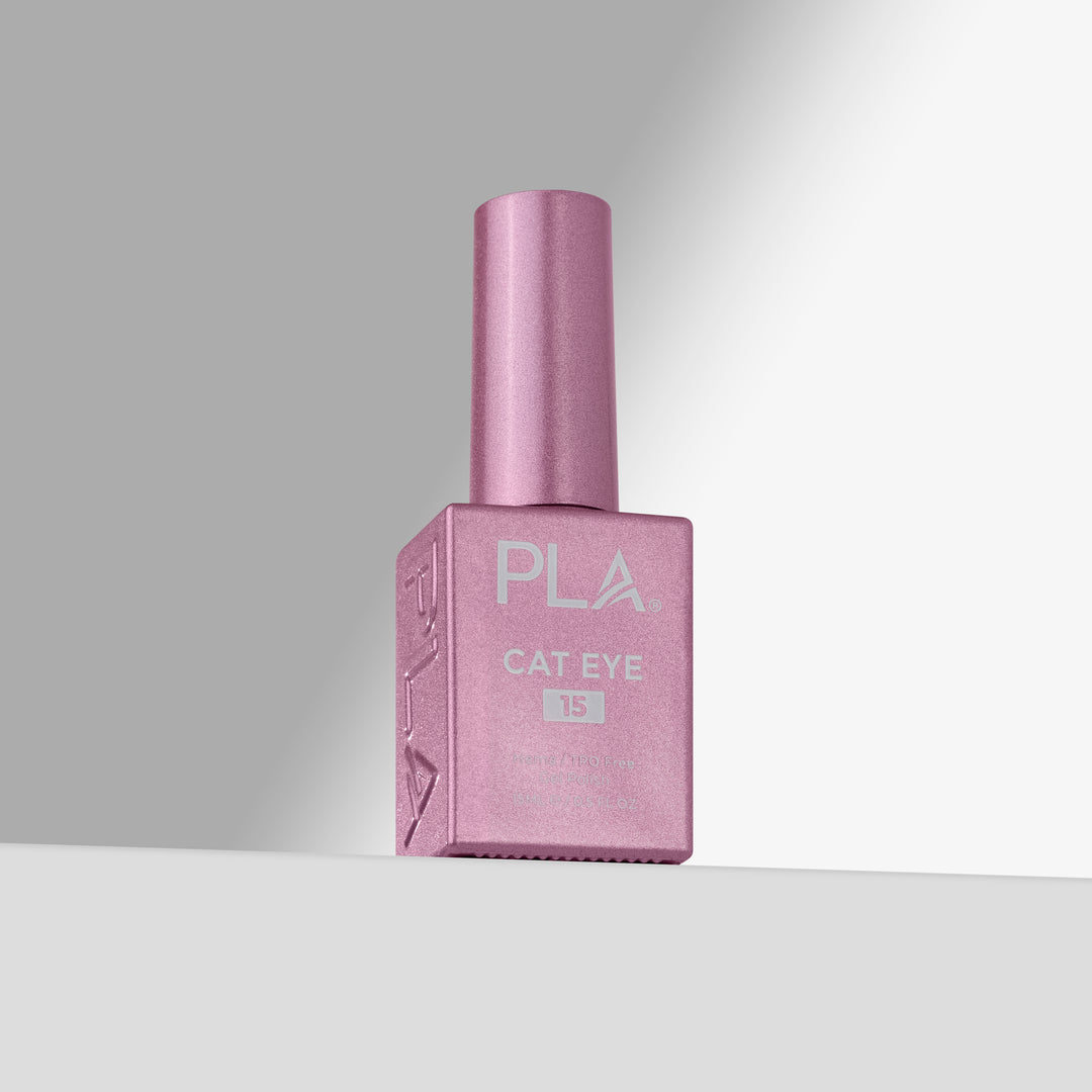 A bottle of PLA Cat Eye gel nail polish in shade 15, featuring a pink cap and a matching pink rectangular bottle with white lettering, set against a clean gray gradient background.