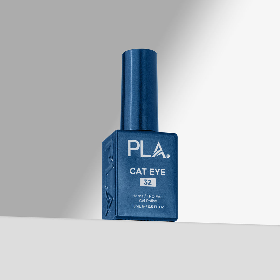A bottle of PLA Cat Eye gel nail polish in shade 32, featuring a deep blue bottle and cap on a clean, light gray studio background.