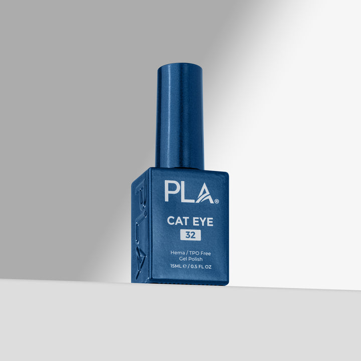 A bottle of PLA Cat Eye gel nail polish in shade 32, featuring a deep blue bottle and cap on a clean, light gray studio background.