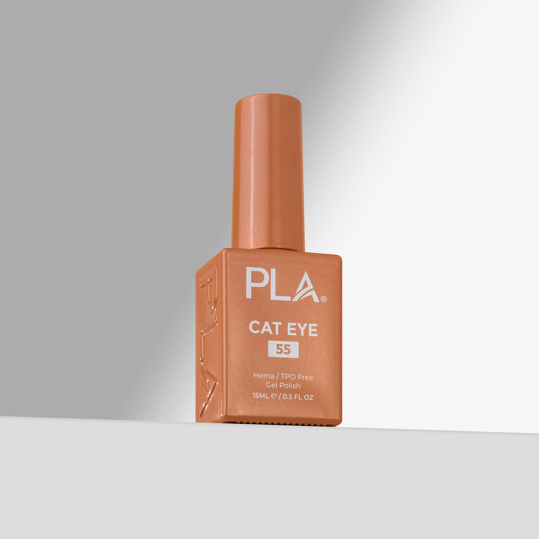 A bottle of PLA Cat Eye nail polish in shade 55, featuring a warm coppery orange color and a matching cap, set against a clean gray studio background