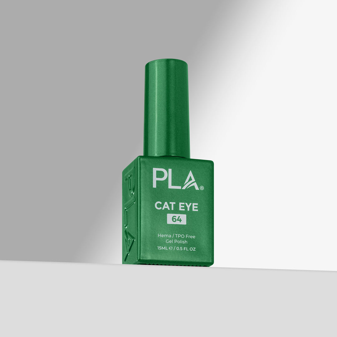 A green bottle of PLA Cat Eye nail polish with shade 64, standing upright on a light gray surface against a gray background.