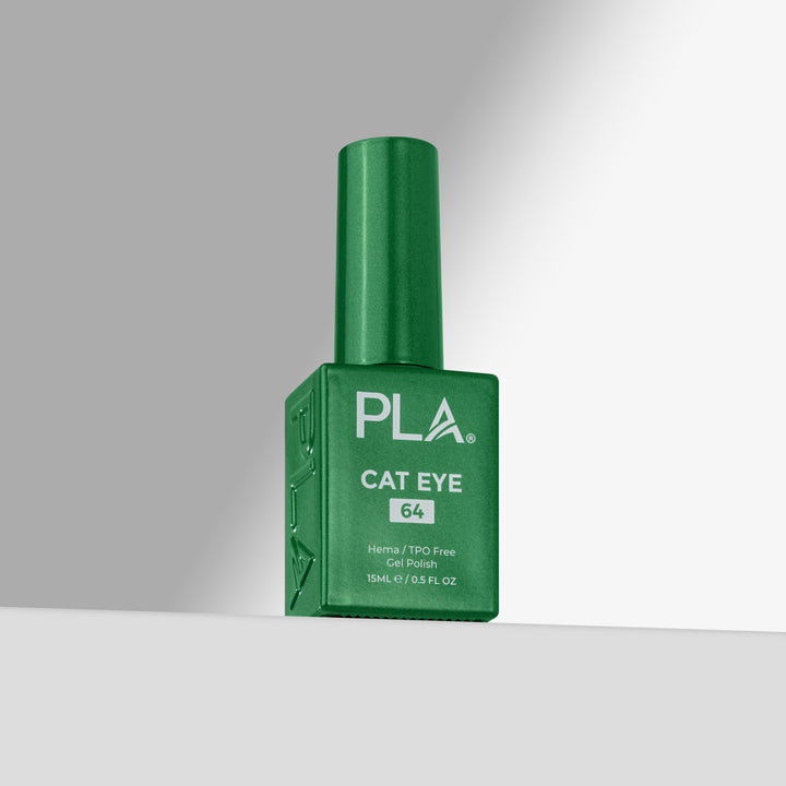 A green bottle of PLA Cat Eye nail polish with shade 64, standing upright on a light gray surface against a gray background.