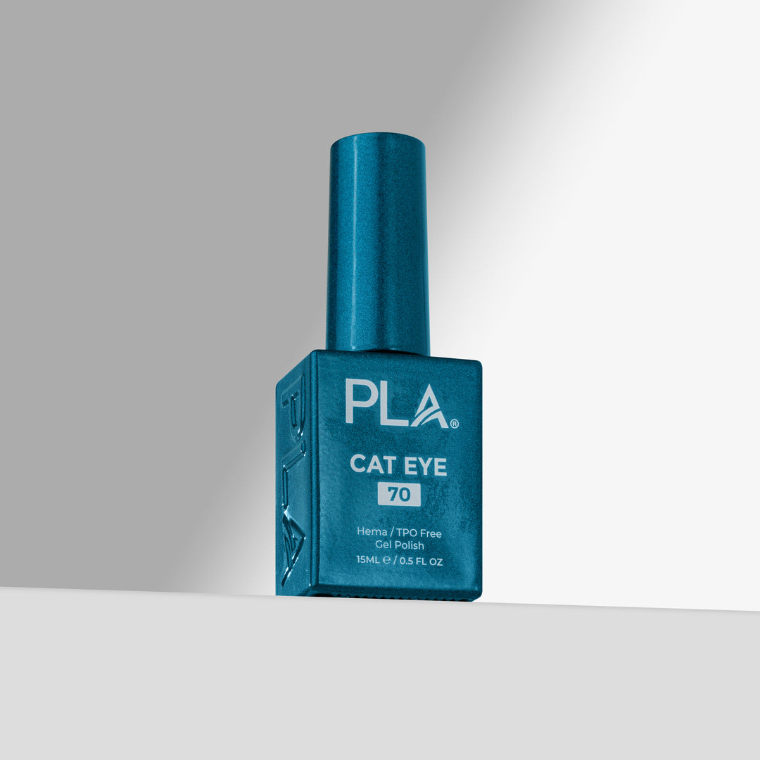 A blue bottle of PLA Cat Eye nail polish shade 70, standing upright on a light gray surface against a gray background 