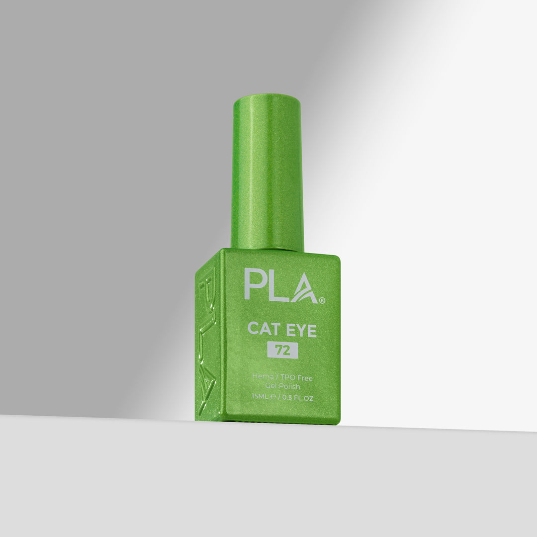 A bottle of green nail polish with a matching green cap, standing upright on a light gray surface against a gray background. The bottle is labeled 'PLA CAT EYE 72'.