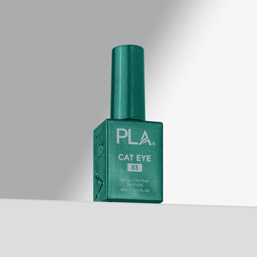 A bottle of PLA Cat Eye nail polish in shade 83, featuring a green cap and a matching green rectangular bottle with white lettering, set against a clean gray studio background.