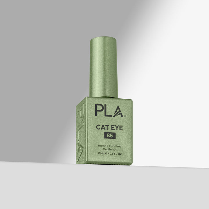 A bottle of PLA Cat Eye gel nail polish in shade 85, featuring a sage green cap and a matching green rectangular bottle with black text, set against a clean gray gradient background.