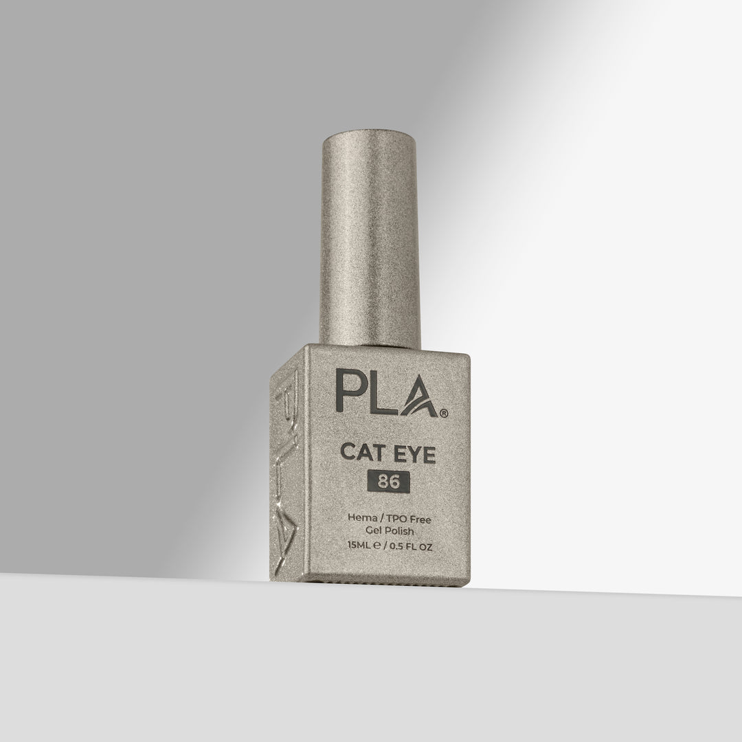 A bottle of PLA Cat Eye nail polish in shade 86, featuring a  silver cap and a silver-gray bottle with black lettering, set against a clean gray gradient background.