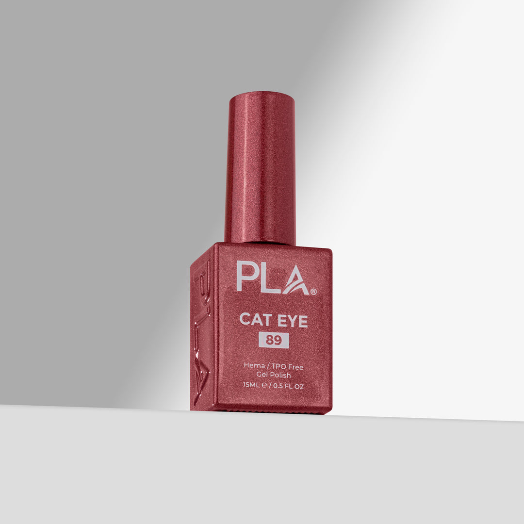A bottle of PLA Cat Eye nail polish in shade 89, featuring a rose shimmer finish with a matching cap, set against a clean gray studio background.