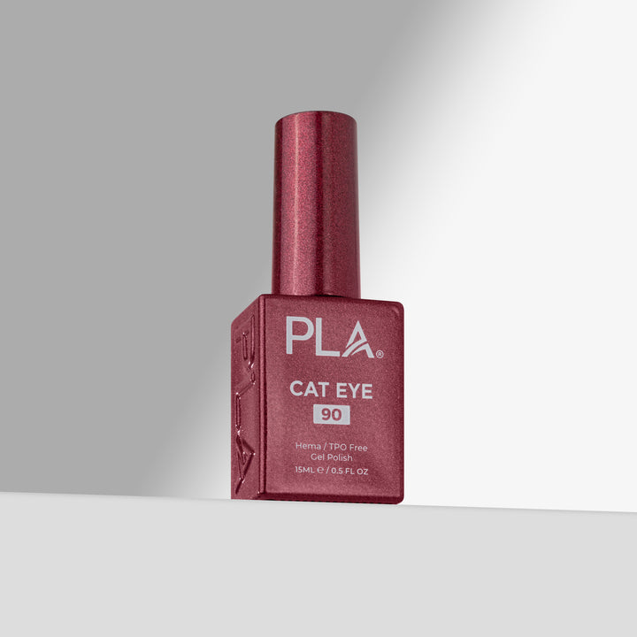 A bottle of PLA Cat Eye gel nail polish in shade 90, featuring a rose cap and a matching rose bottle with white text, set against a clean gray studio background.