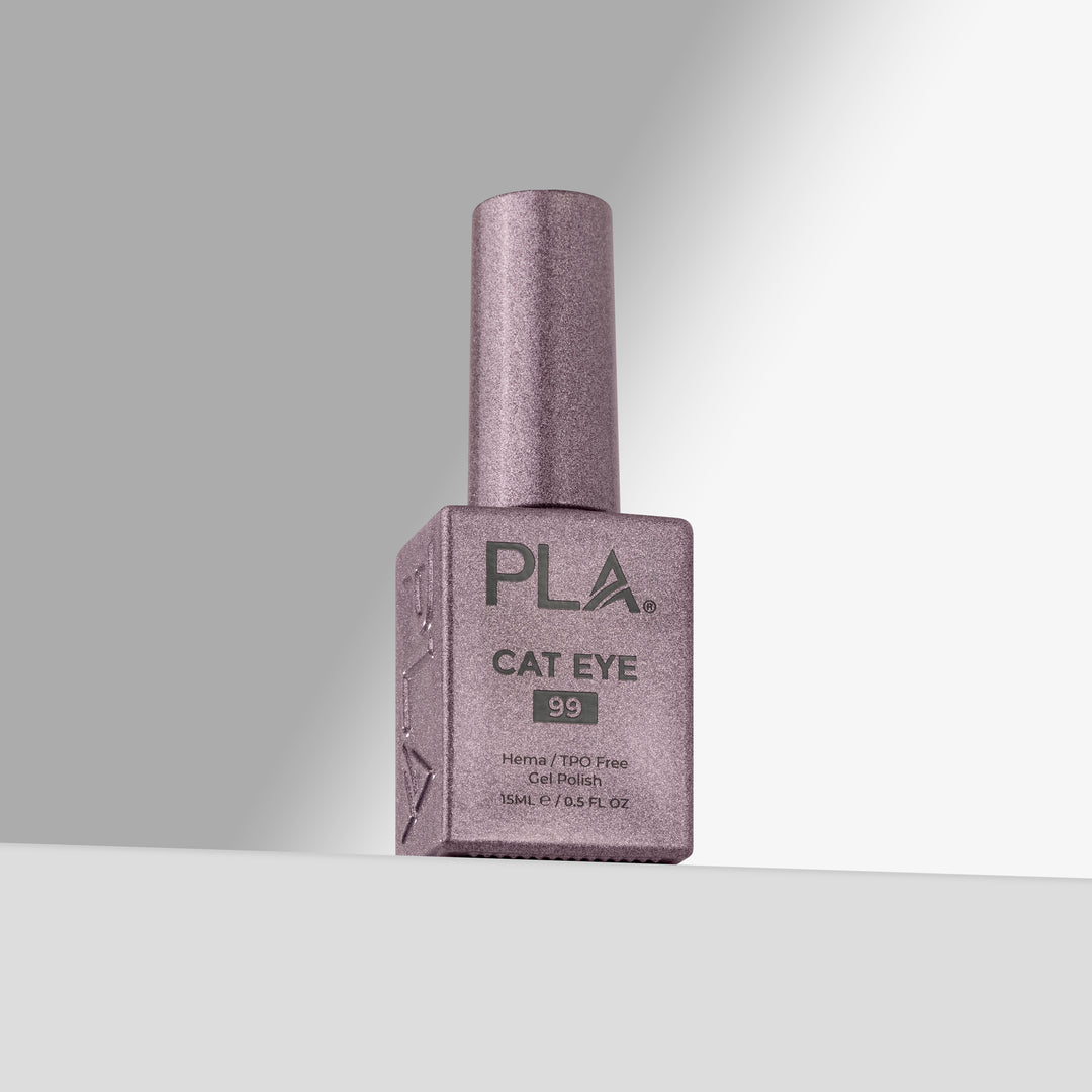 A bottle of PLA Cat Eye nail polish in shade 99, featuring a shimmering  lavender-pink color with a matching cap, set against a clean gray studio background.