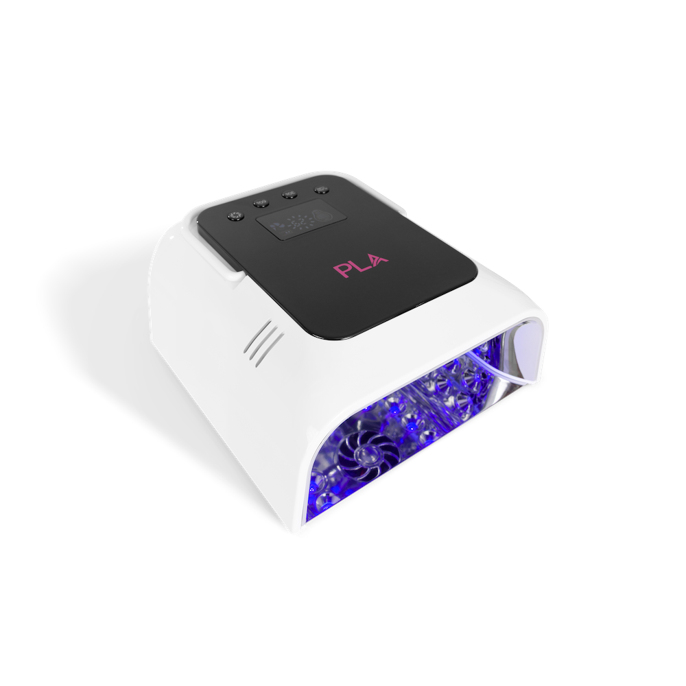 A white UV LED nail lamp with a black control panel featuring pink PLA branding, emitting blue light from the open front compartment, shown on a white background.