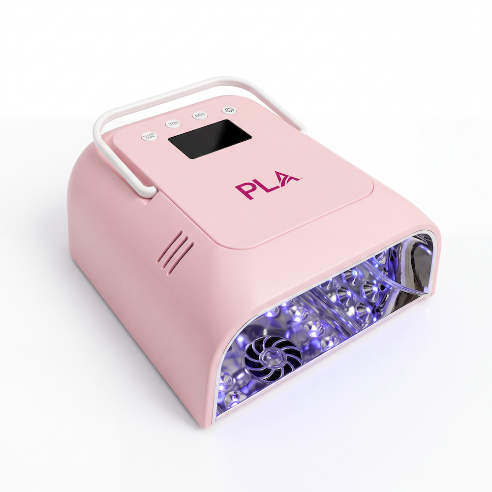 A pink UV LED nail lamp with a black control panel featuring pink PLA branding, emitting blue light from the open front compartment, shown on a white background.